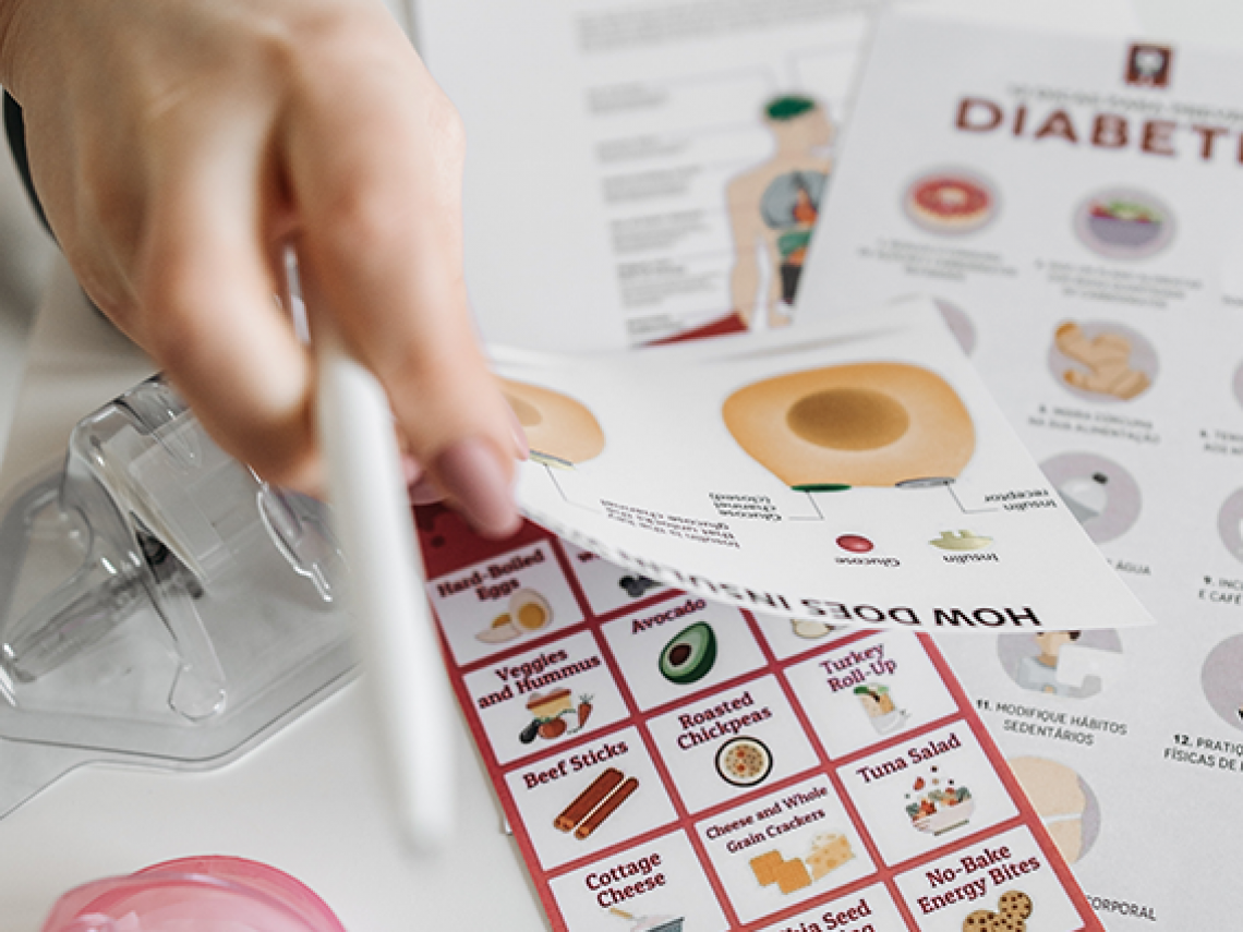 Someone holding diabetic fliers.